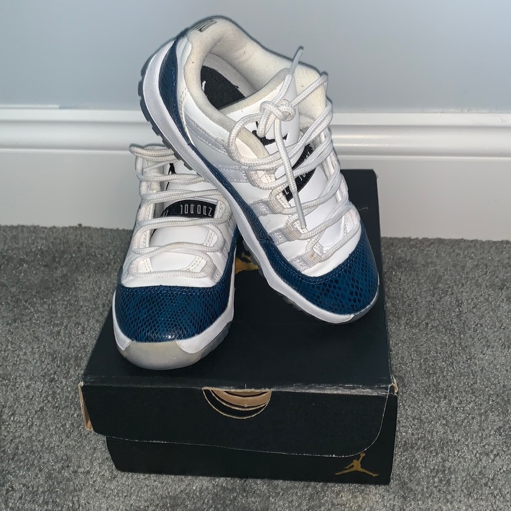 Boys Blue and white snakeskin Jordan 11 sneakers.